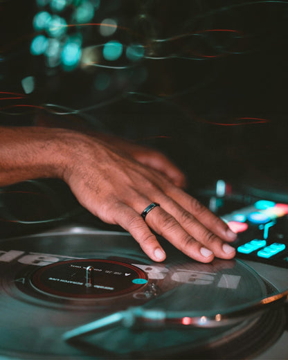 Man wearing black payment ring tapping to pay