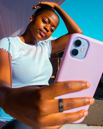 Women wearing black payment ring tapping to pay
