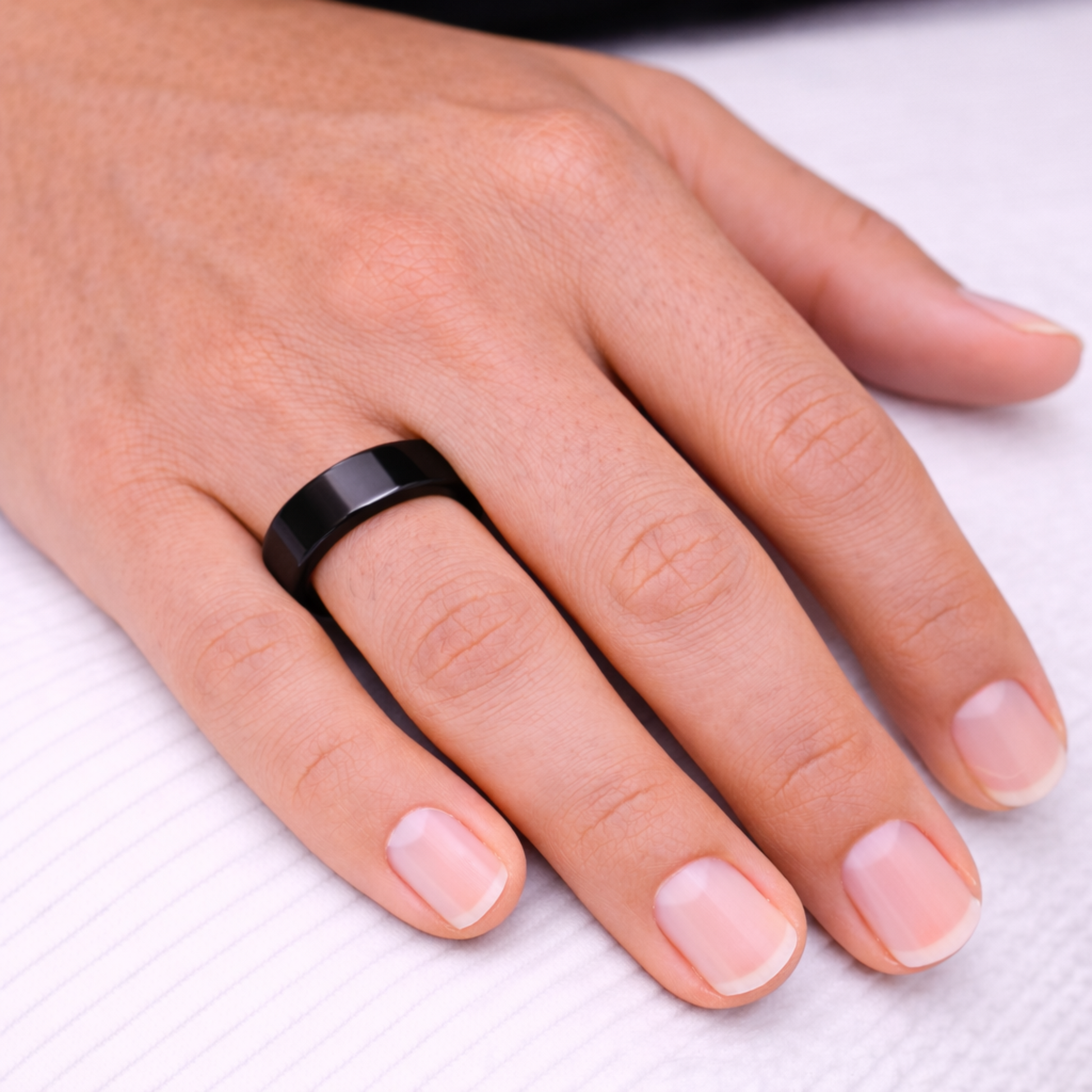 Woman wearing Twinn Classic Black ceramic contactless payment ring