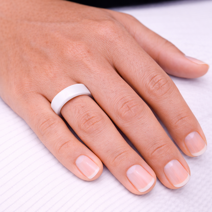 Woman wearing Twinn classic white ceramic contactless payment ring