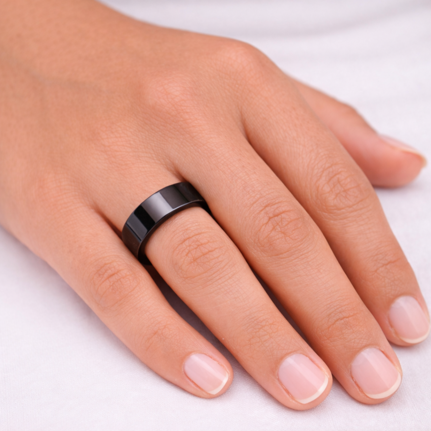 Woman wearing Twinn Metal Black contactless payment ring