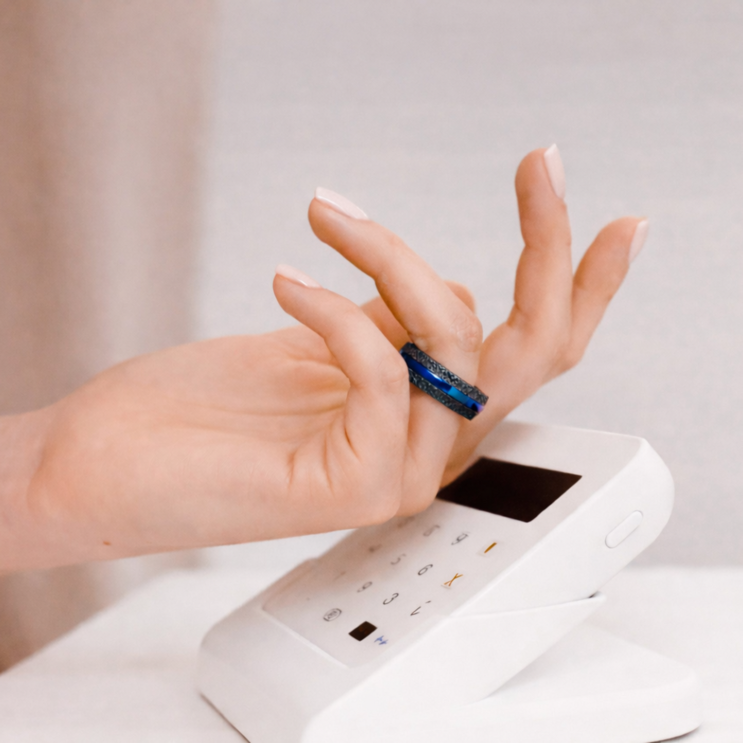 Using Twinn metal blue payment ring on contactless payment terminal