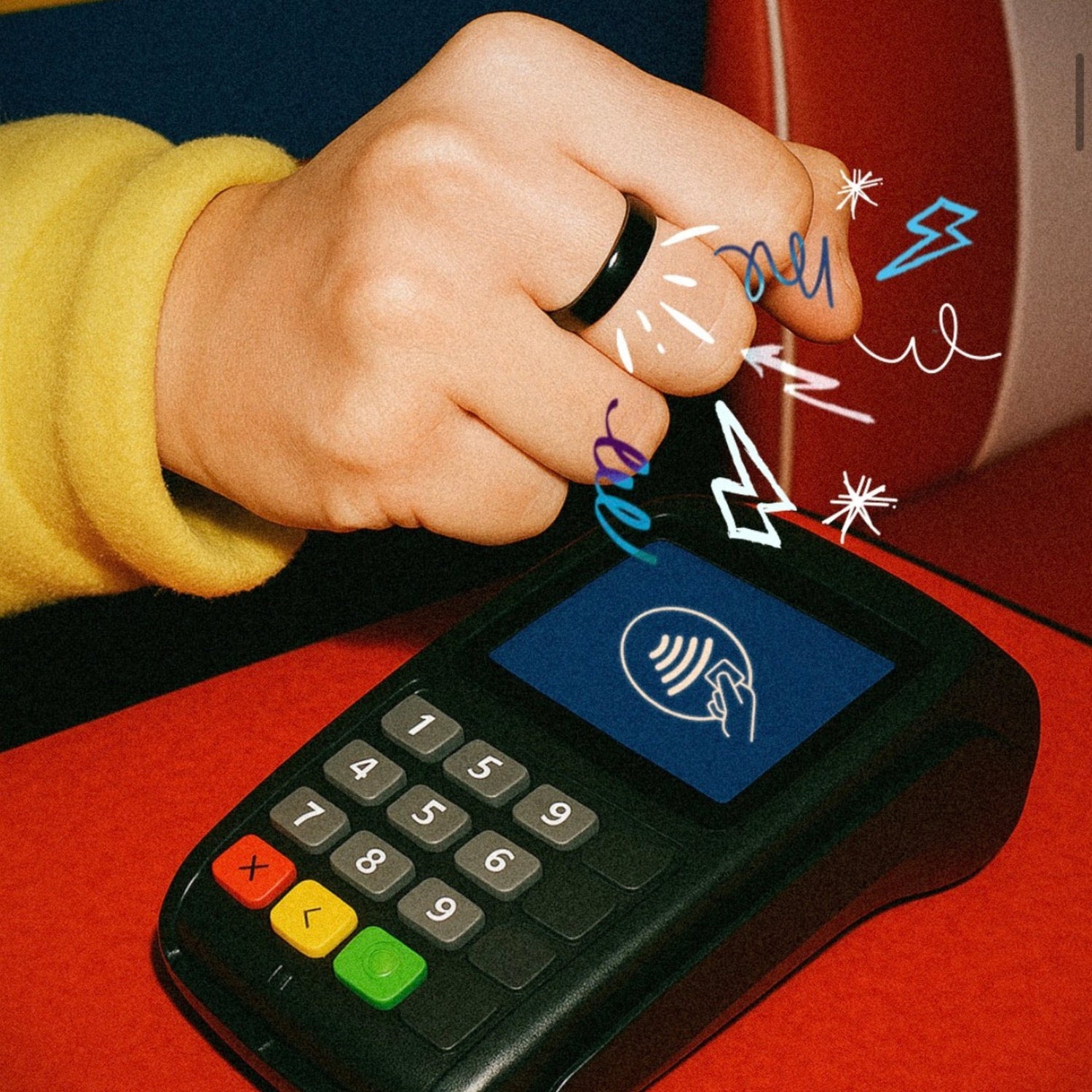 Twinn OG black ceramic contactless payment ring being used to tap a card reader