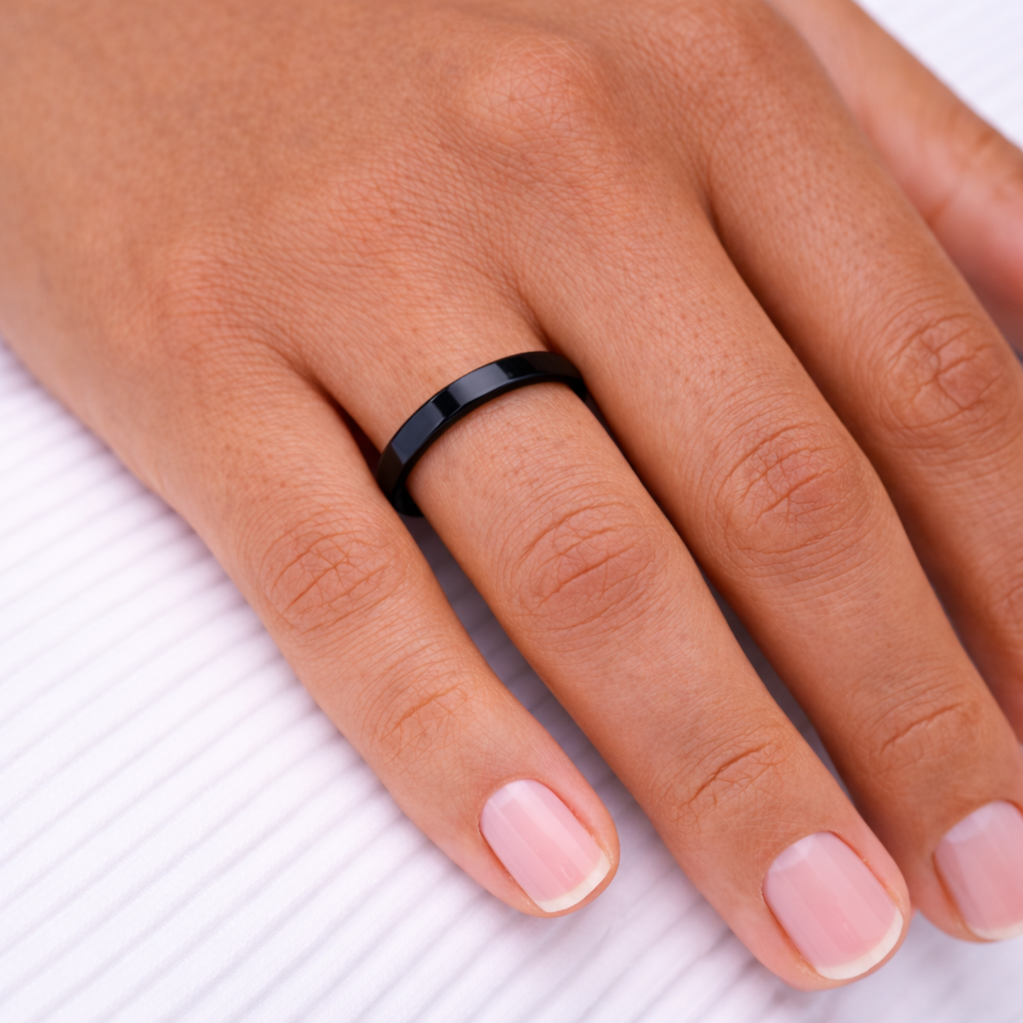 Woman wearing Twinn Ultra Black ceramic contactless payment ring