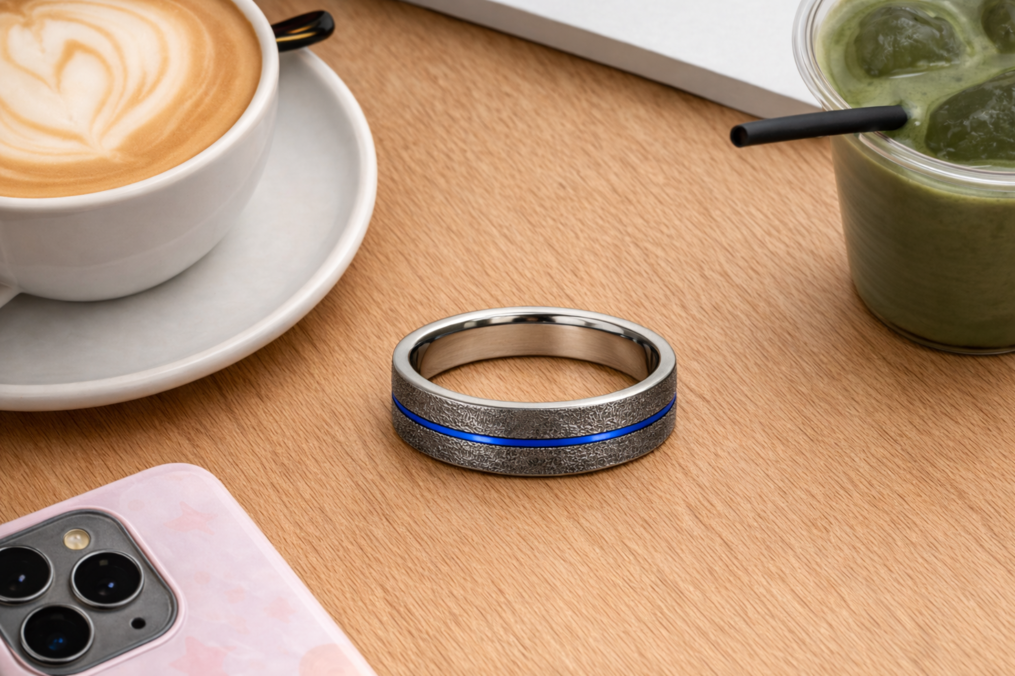  Twinn Metal Blue payment ring on a table in a cafe